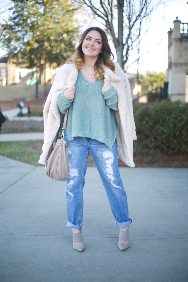 Mae Amor- green oversized v-neck knit sweater, boyfriend jeans, medium length ombre hair, shearling jacket, bucket bag, grey suede mules