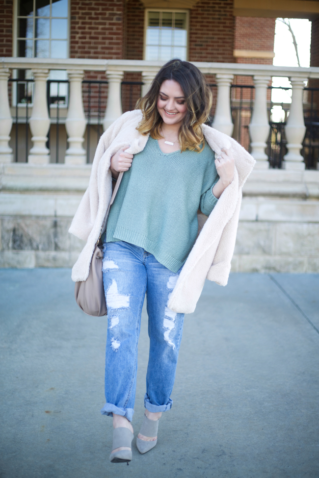 Mae Amor- green oversized v-neck knit sweater, boyfriend jeans, medium length ombre hair, shearling jacket, bucket bag, grey suede mules