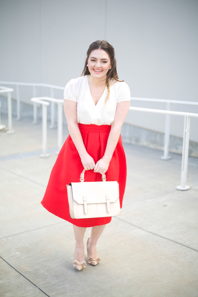 Valentine's Day, red midi skirt, white blouse, dainty gold jewelry, nude pumps with bow, blush bag, half up hairstyle